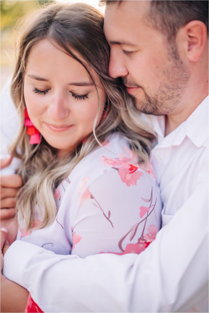 Couple snuggling during engagement session