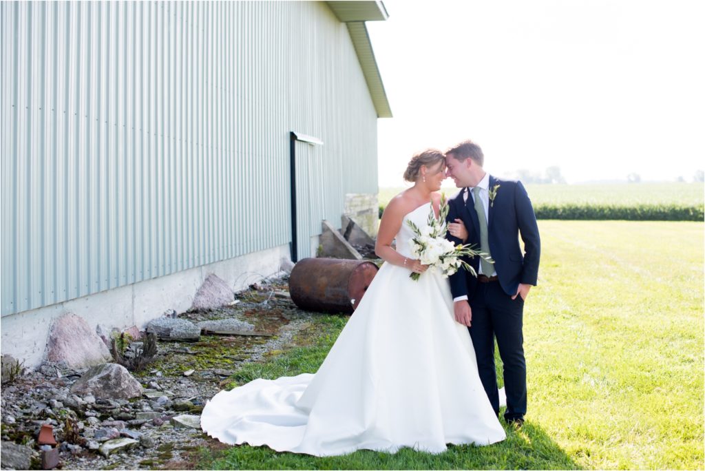 couple in front of blue barn