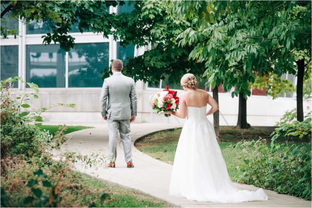 Emotional first look with the bride and groom at the Indiana State Museum