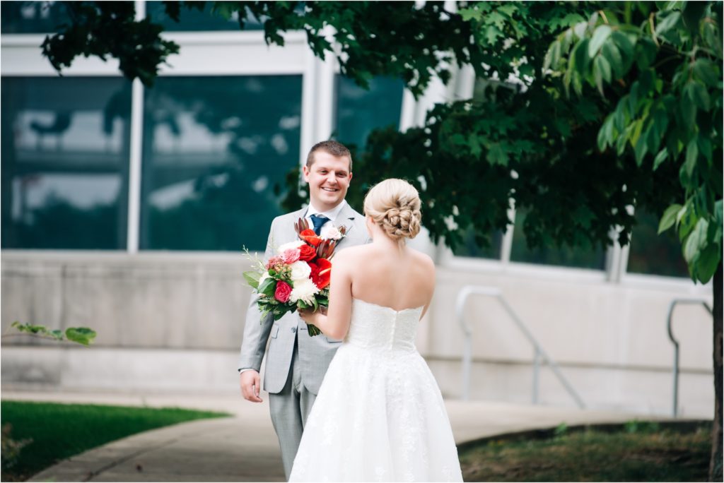 Adorable first look with the bride and groom at the Indiana State Museum in Indianapolis