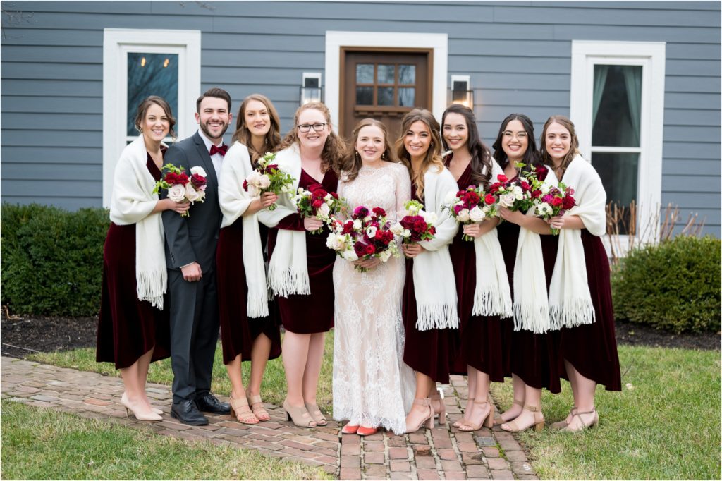 bride and bridesmaid photos outside of house at mustard seed