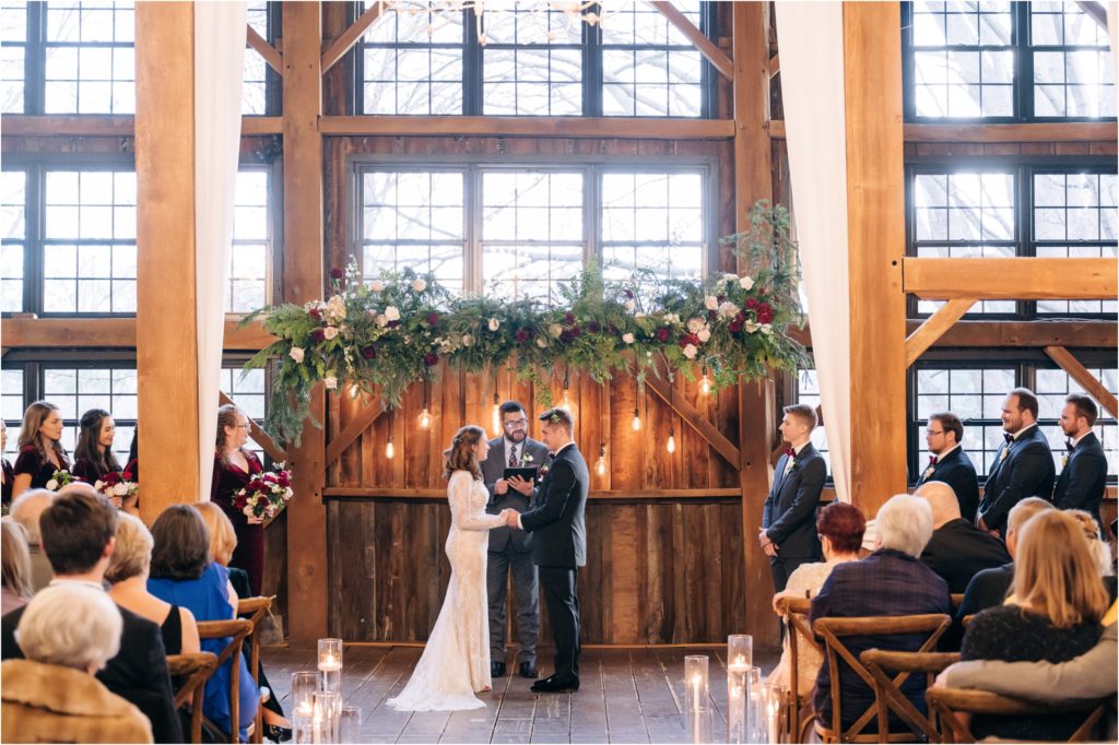Christmas barn ceremony hanging floral installation