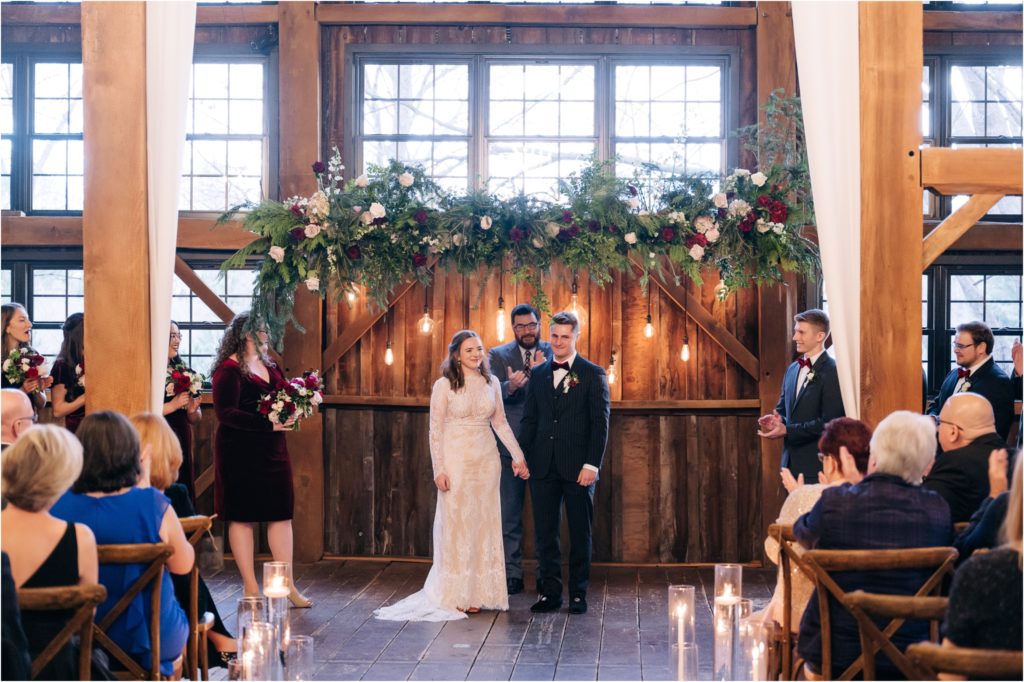 Christmas Winter Wedding in the midwest floral ceremony arch 
