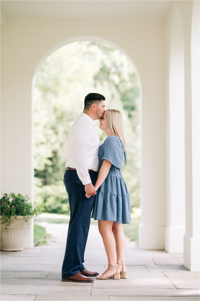 Timeless kiss engagement session on the terrace