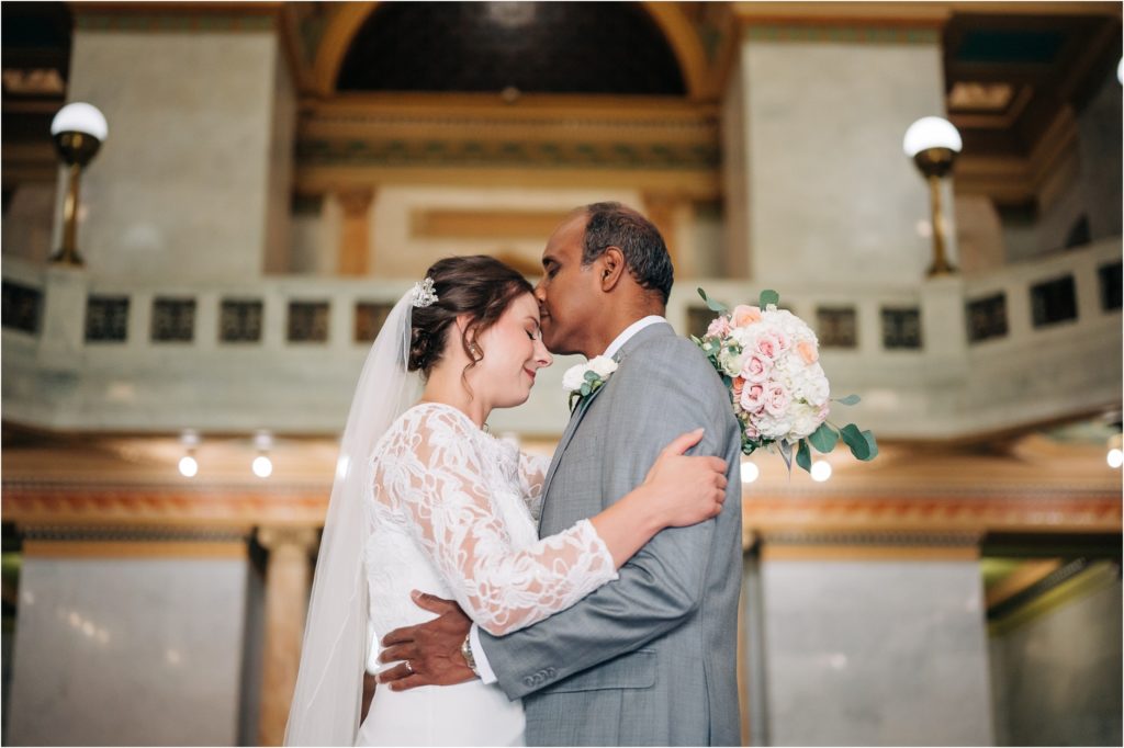 bride and groom portraits in the allen county courthouse